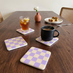 Me Time coasters in Lavender Cream on a walnut dining table